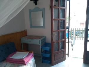 A bed or beds in a room at Haus Pigadi