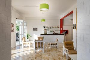 a living room with a table and chairs at Hotel la Perla in Tropea