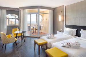Кровать или кровати в номере AP Oriental Beach - Adults Friendly