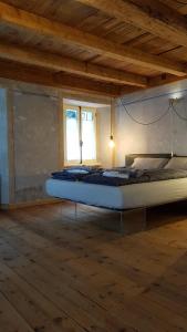 Postel nebo postele na pokoji v ubytování BnB Ai Cav Calanca