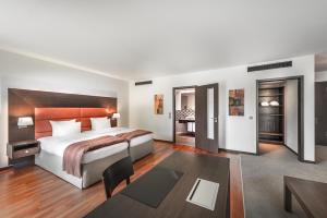 Postel nebo postele na pokoji v ubytování Aparthotel am Golfclub Treudelberg + 37 fotografií