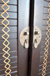 a close up of two metal doors with handles at Chambre d'hôtes Les Nymphéas in Wimereux