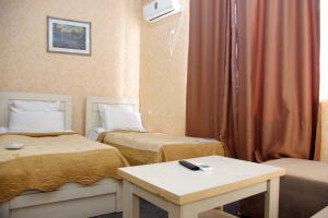 Voodi või voodid majutusasutuse Hotel Shalimar toas