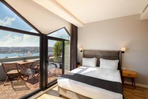 Postel nebo postele na pokoji v ubytování DORUK PALAS HOTEL
