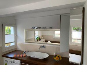 a bathroom with a sink and a mirror at Buxhaus in Solingen