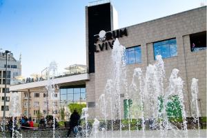a water fountain in front of a building at Mini Apartment on Kulisha 29-3 in Lviv