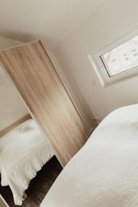 Кровать или кровати в номере Apartment Strandnüst