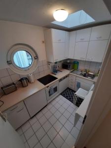 an overhead view of a kitchen with a window at Sophies Apartment in Stuttgart