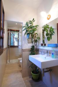 a bathroom with a sink and a shower and a toilet at APPARTAMENTO PARADISO CA' GIULIA in Venice