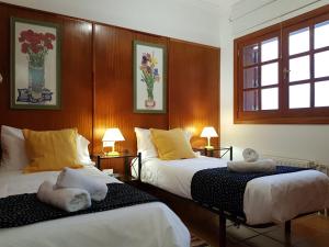 a bedroom with two beds with towels on them at Teresita High Views with private pool in Santa Brígida