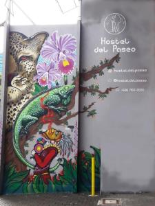 a book with a painting of a chinese dragon at Hotel del Paseo in San José