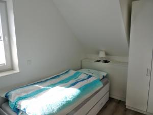 Ein Bett oder Betten in einem Zimmer der Unterkunft Ferienhaus Schomaker