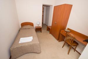 Ein Bett oder Betten in einem Zimmer der Unterkunft Deims Hotel