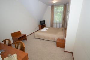 Ein Bett oder Betten in einem Zimmer der Unterkunft Deims Hotel