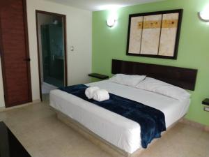 Un ou plusieurs lits dans un hébergement de l'établissement Marina del Sol 306/2Recamaras/Acceso a la Playa/Alberca