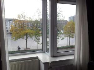 
a window with a view of a building at Hotel Baan in Rotterdam
