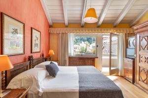 Postel nebo postele na pokoji v ubytování Hotel Pironi