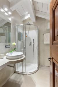 a bathroom with a shower and a sink at Hotel Pironi in Cannobio