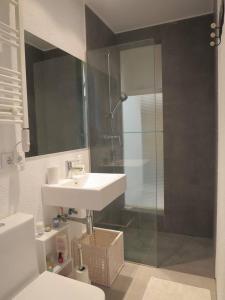 a bathroom with a sink and a glass shower at come and enjoy ! in Cadaqués