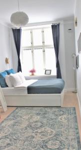 Postel nebo postele na pokoji v ubytování Home Studio Maria