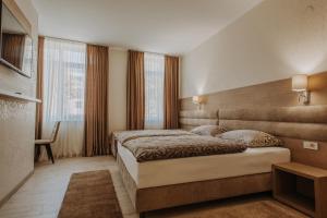 Postel nebo postele na pokoji v ubytování Villa Martini - apartments & rooms
