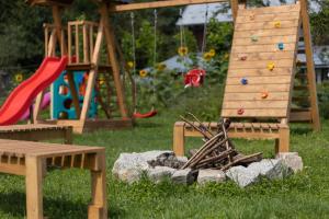 a park with a playground with a slide and a play structure at Dobre Miejsce in Ustrzyki Dolne