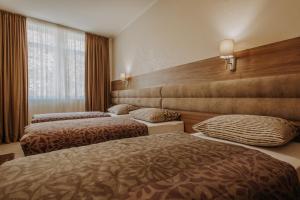 Postel nebo postele na pokoji v ubytování Villa Martini - apartments & rooms