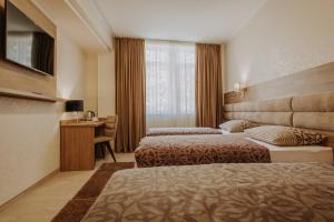 Postel nebo postele na pokoji v ubytování Villa Martini - apartments & rooms