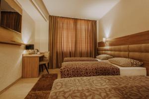 Postel nebo postele na pokoji v ubytování Villa Martini - apartments & rooms