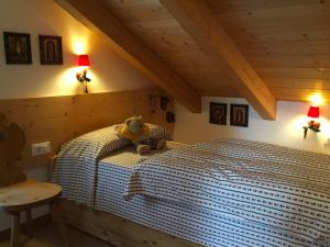 Postel nebo postele na pokoji v ubytování Mansarda Dolomiti