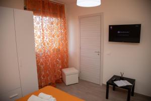 TV a/nebo společenská místnost v ubytování B&B Miramare Suite