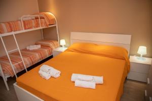 Postel nebo postele na pokoji v ubytování B&B Miramare Suite