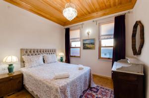 Ein Bett oder Betten in einem Zimmer der Unterkunft Dutlu Konak