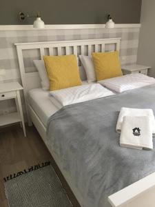 
Łóżko lub łóżka w pokoju w obiekcie Sosnowe Tarasy
