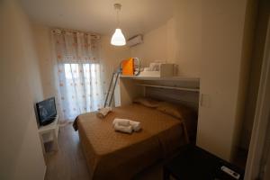 Postel nebo postele na pokoji v ubytování B&B Miramare Suite