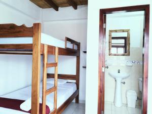 Voodi või voodid majutusasutuse Cocoa Inn Hostal toas