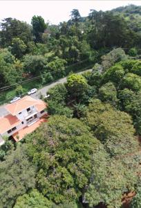 an aerial view of a house in the midst of trees at CASA GERANIOS # 2 in Monteverde Costa Rica