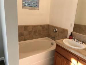 a bathroom with a tub and a sink at Spacious 3BD,2BA, ideal for families! in Santa Rosa
