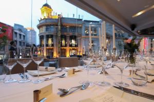 a table with wine glasses sitting on a table at Radisson Collection Hyland Shanghai in Shanghai