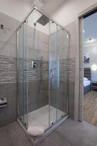a shower with a glass enclosure in a bathroom at Vatican City Relais in Rome