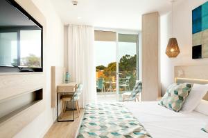 Llit o llits en una habitació de Diamant Hotel & Aparthotel