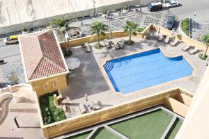 a house that has a pool in it at California Hostel Dubai Beach in Dubai