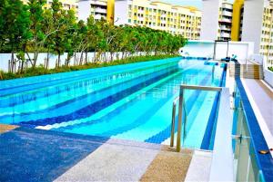 a large swimming pool on the side of a building at Seaview Landmark Studio Homestay at Gurney 无敌海景套房 in Tanjong Tokong