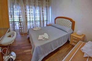 Кровать или кровати в номере La Fiera GuestHouse