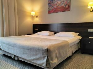 Кровать или кровати в номере Отель Кайзерхоф