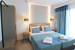 Postel nebo postele na pokoji v ubytování Varkotopi Villas + 37 fotografií