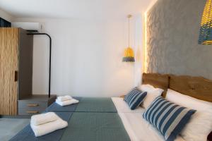 Postel nebo postele na pokoji v ubytování Varkotopi Villas