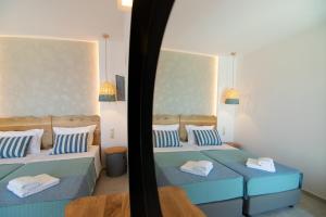 Postel nebo postele na pokoji v ubytování Varkotopi Villas