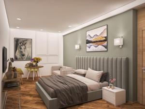 a bedroom with a bed and a couch and a table at Centric Baku Boutique Hotel in Baku