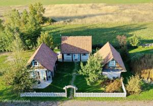 an aerial view of a house in a field at Wilkowa Chata in Wilków